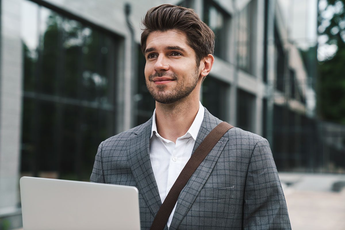 optimistic-handsome-business-man-using-laptop-2021-08-29-02-45-19-utc